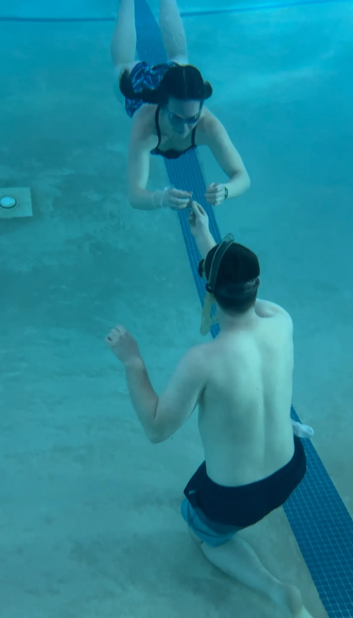 Elliott proposing to Rebekah underwater at the pool in Columbia, South Carolina